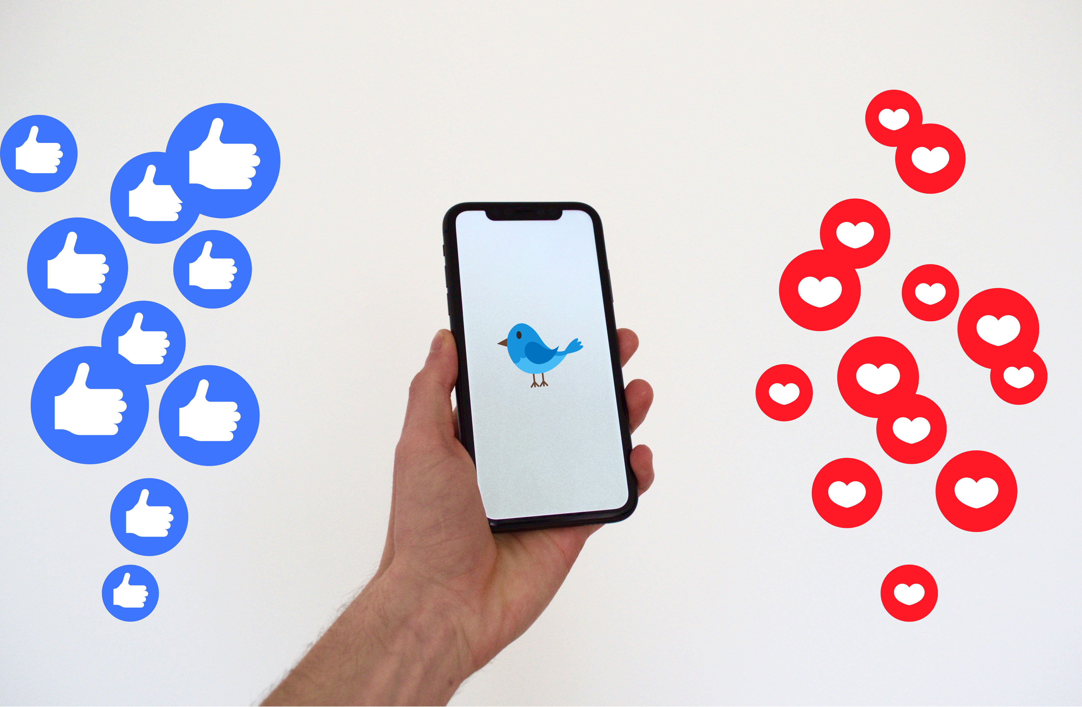 A mobile phone with a blue bird and some emojis around it